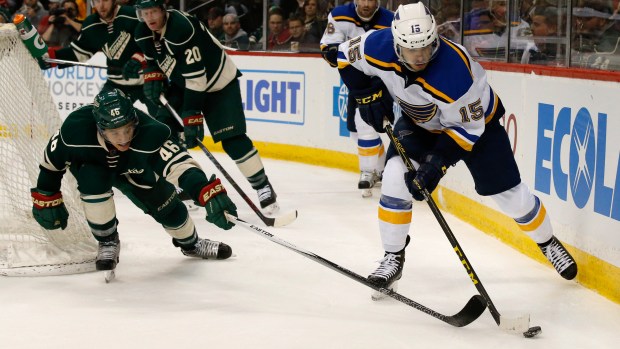 St. Louis Blues center Robby Fabbri (15) controls the puck in front of Minnesota Wild defenseman Jared Spurgeon (46) during the second period of an NHL hockey game in St. Paul, Minn., Sunday, March 6, 2016. (AP Photo/Ann Heisenfelt)