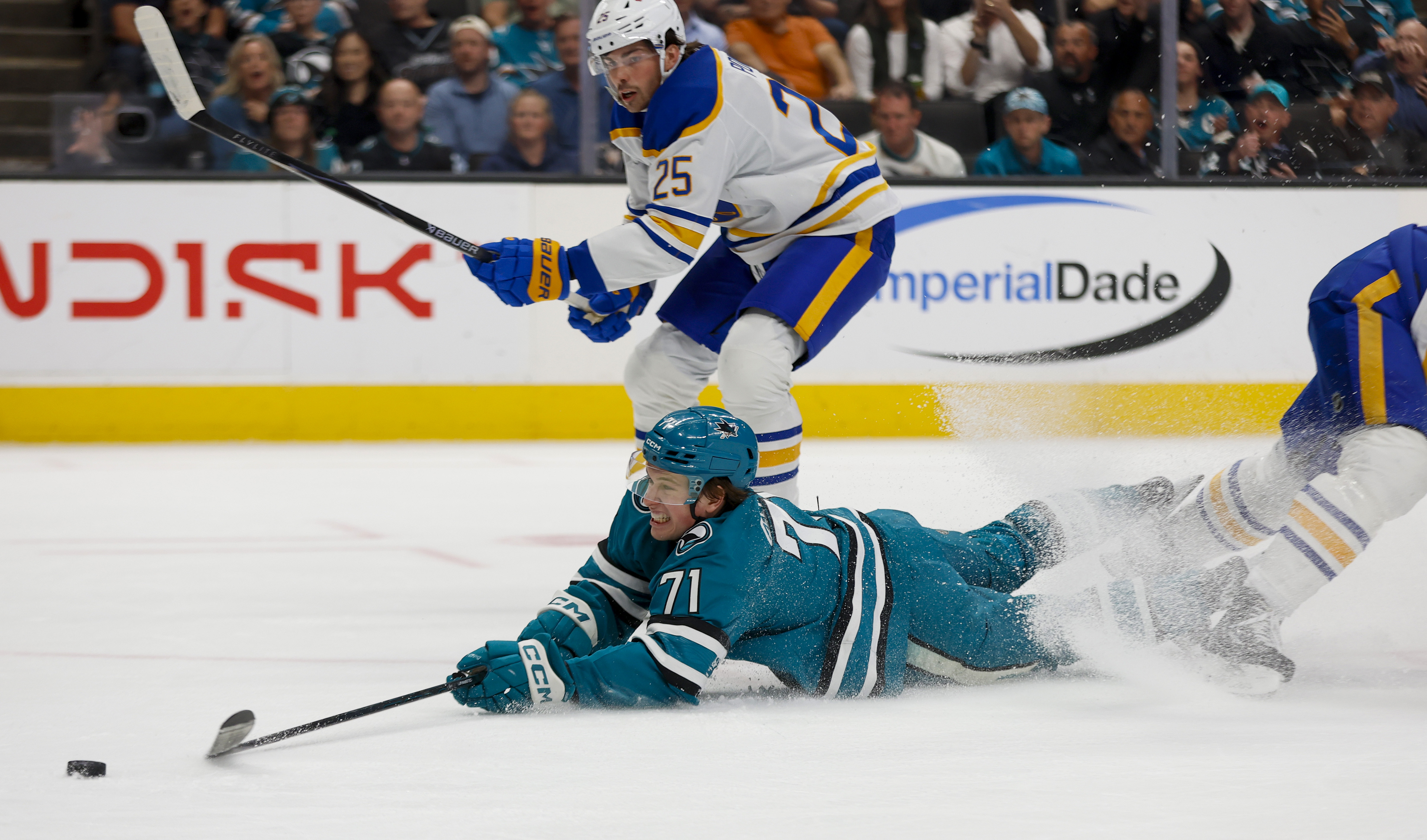 San Jose Sharks' Macklin Celebrini (71) tries to get a...