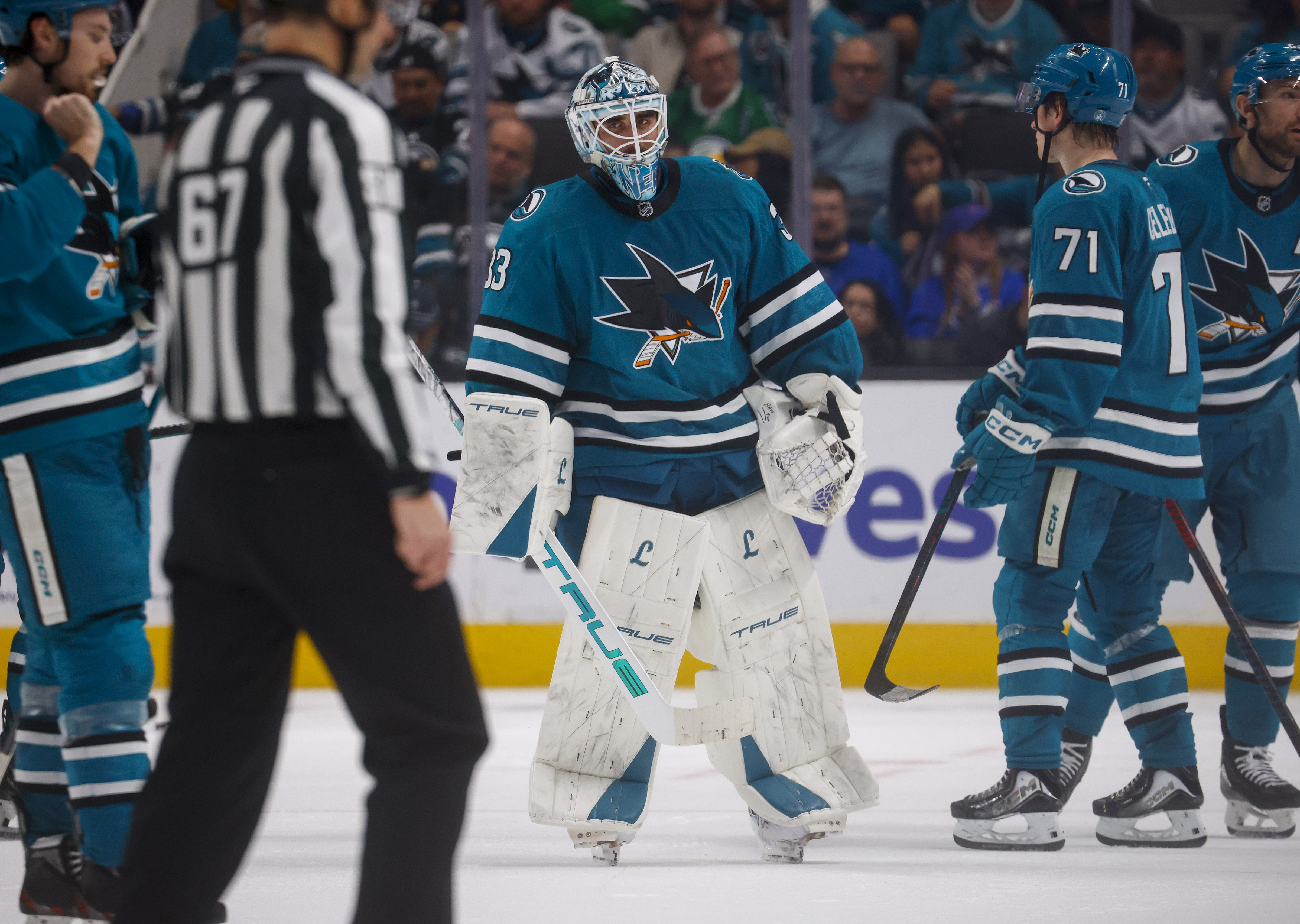 San Jose Sharks goaltender Alex Nedeljkovic (33) skates off the...