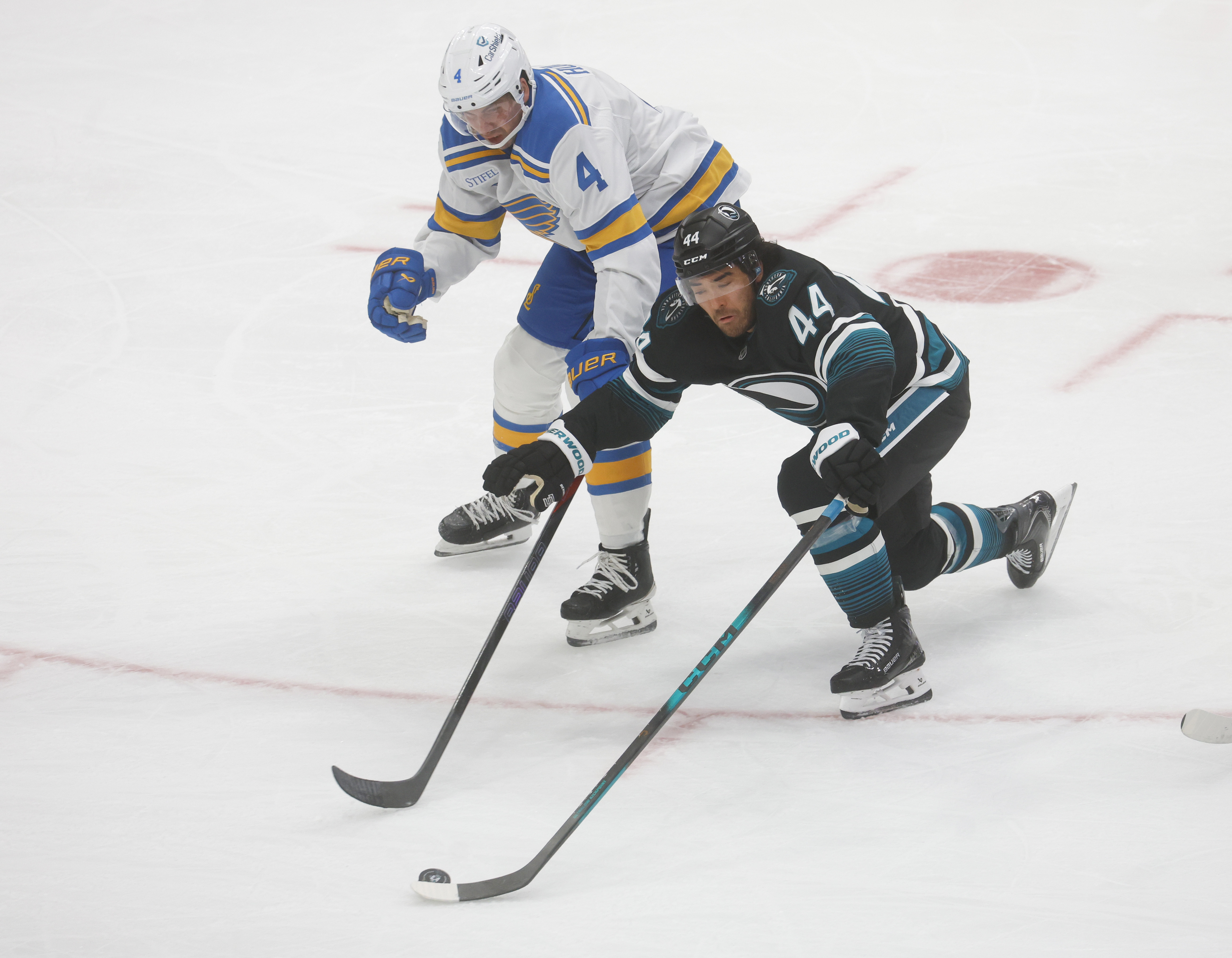 San Jose Sharks’ Kiefer Sherwood (44) fights for the puck...