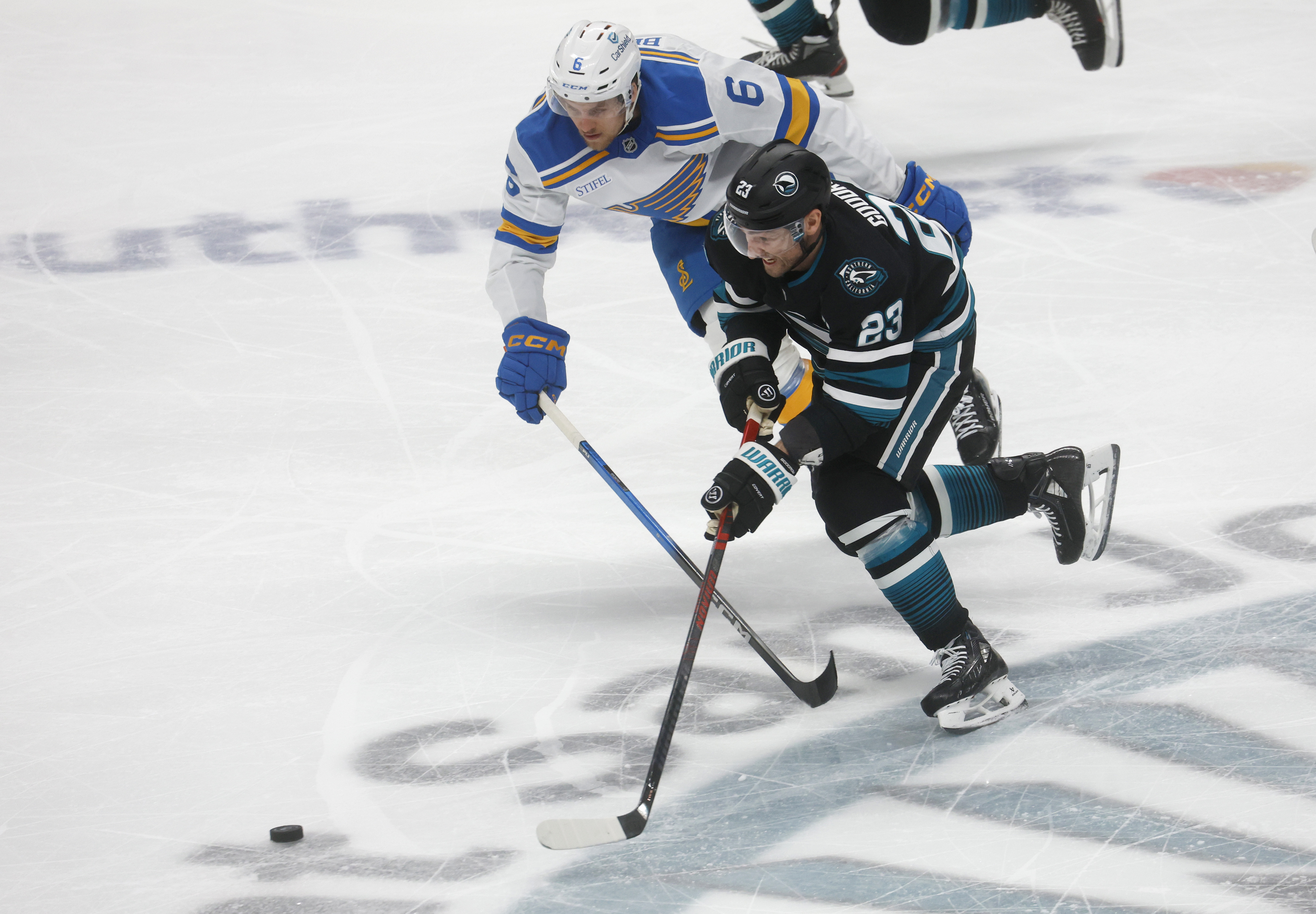 San Jose Sharks’ Barclay Goodrow (23) fights for the puck...