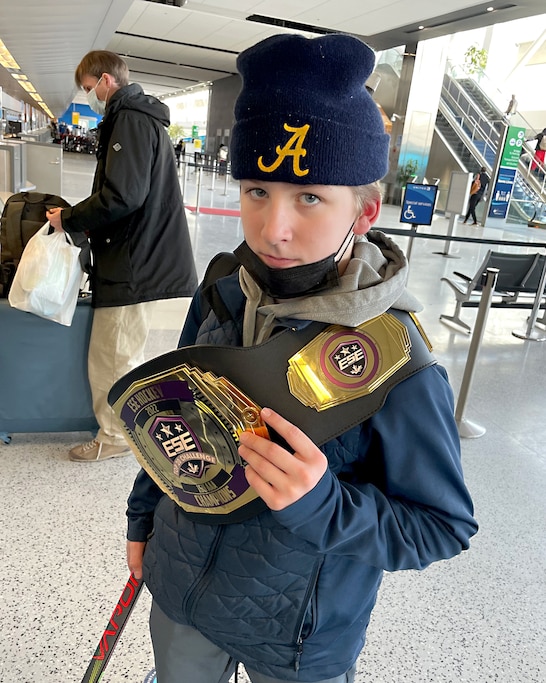 Cole Hutson at age 14, in the airport after his team won the top-20 tournament in 2021 in Detroit.