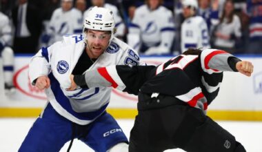 Tampa Bay Lightning left wing Brandon Hagel (38) and Buffalo Sabres center Peyton Krebs fight during the first period of an NHL hockey game, Sunday, March 8, 2026, in Buffalo, N.Y. (AP Photo/Jeffrey T. Barnes)