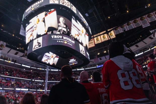 Chicago Blackhawks fans stand during a moment of silence for Troy Murray in the first period of a game against the Mammoth on Monday, March, 9, 2026, at the United Center. (Josh Boland/Chicago Tribune)