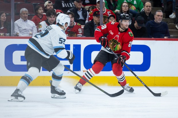 Chicago Blackhawks left wing Andre Burakovsky (28) skates with the puck as Utah Mammoth defenseman MacKenzie Weegar (52) defends in the first period against the Mammoth on Monday, March, 9, 2026, at the United Center. (Josh Boland/Chicago Tribune)