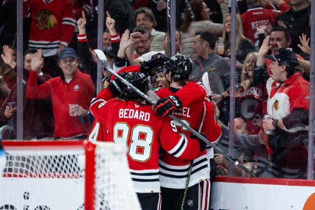 Chicago Blackhawks players celebrate a goal by Chicago Blackhawks left wing Andre Burakovsky (28) in the second period against the Mammoth on Monday, March, 9, 2026, at the United Center. (Josh Boland/Chicago Tribune)
