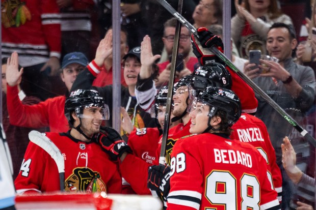 Chicago Blackhawks players celebrate a goal by Chicago Blackhawks left wing Andre Burakovsky (28) in the second period against the Mammoth on Monday, March, 9, 2026, at the United Center. (Josh Boland/Chicago Tribune)