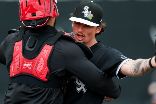White Sox starter Davis Martin celebrates with catcher Edgar Quero after throwing in the bullpen during spring training at Camelback Ranch on Feb. 18, 2026, in Glendale, Ariz. (Eileen T. Meslar/Chicago Tribune)