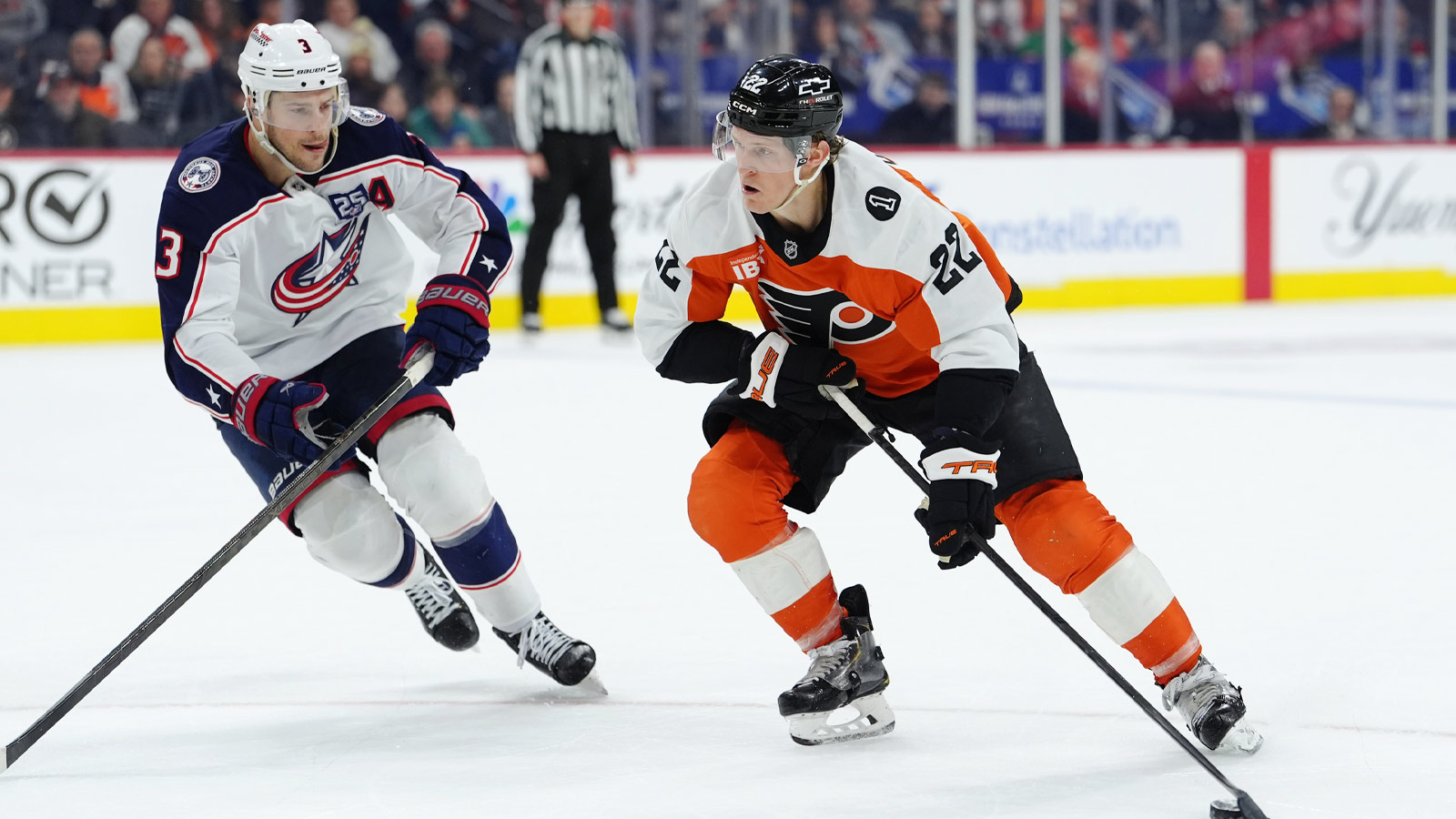 Philadelphia Flyers center Christian Dvorak (22) controls the puck against Columbus Blue Jackets center Charlie Coyle (3) in overtime at Xfinity Mobile Arena. 