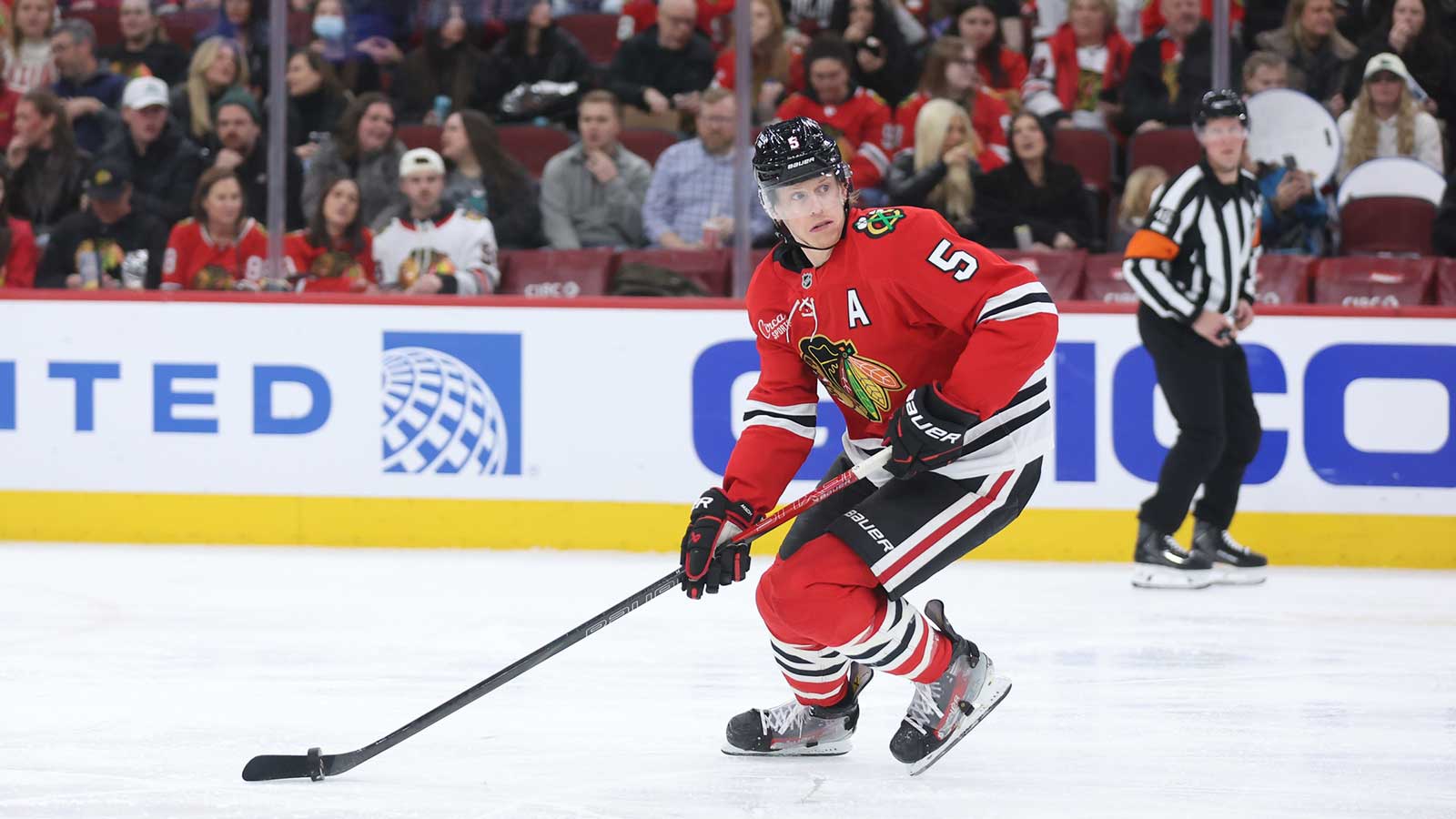 Chicago Blackhawks defenseman Connor Murphy (5) skates with the puck during the second period against the San Jose Sharks at United Center