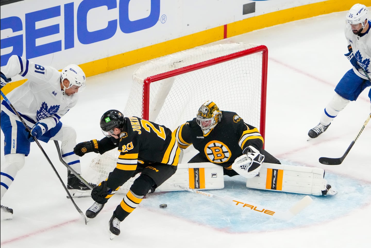 Bruins goaltender Jeremy Swayman (1) made a pad save to help preserve a 1-0 first-period lead in Tuesday night's game against the Maple Leafs at TD Garden.