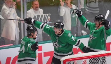 Dallas Stars center Mikael Granlund (64) celebrates a goal with teammates Jason Robertson (21) and Mason Marchment during the third period in Game 1 of the Western Conference finals in the NHL hockey Stanley Cup playoffs against the Edmonton Oilers, Wednesday, May 21, 2025, in Dallas. (AP Photo/LM Otero)