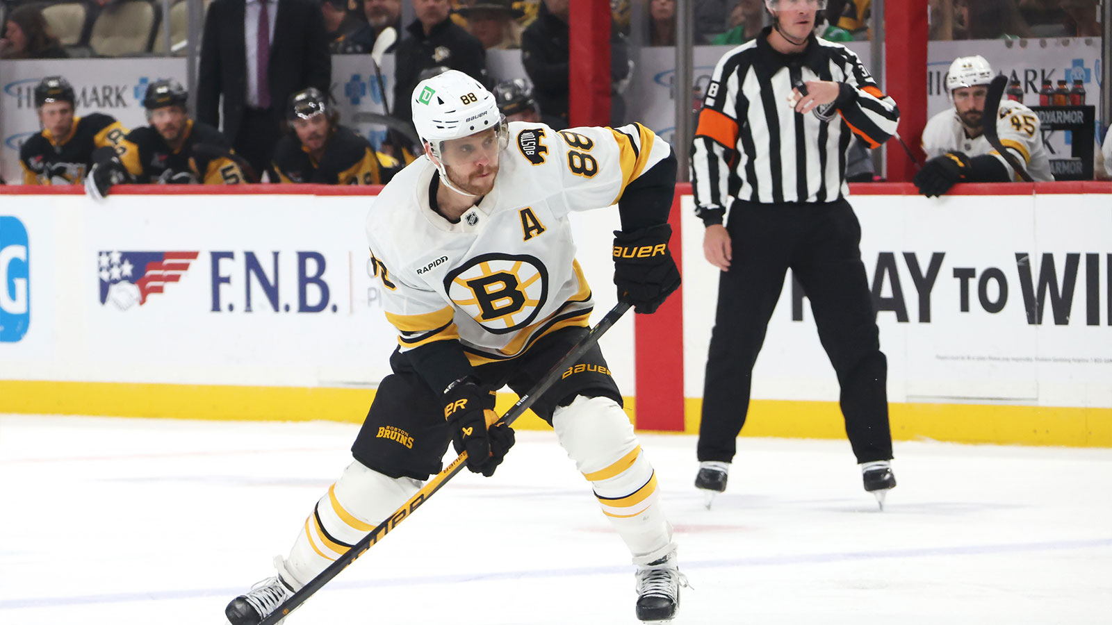 Boston Bruins right wing David Pastrnak (88) shoots the puck against the Pittsburgh Penguins during the second period at PPG Paints Arena. 