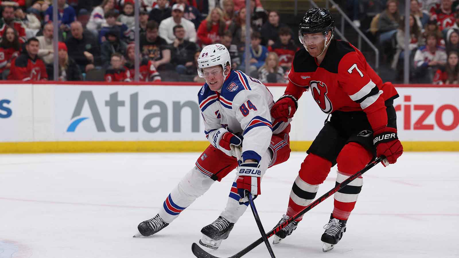 New York Rangers center Adam Edstrom (84) moves the puck while New Jersey Devils defenseman Dougie Hamilton (7) defends during the first period at Prudential Center.
