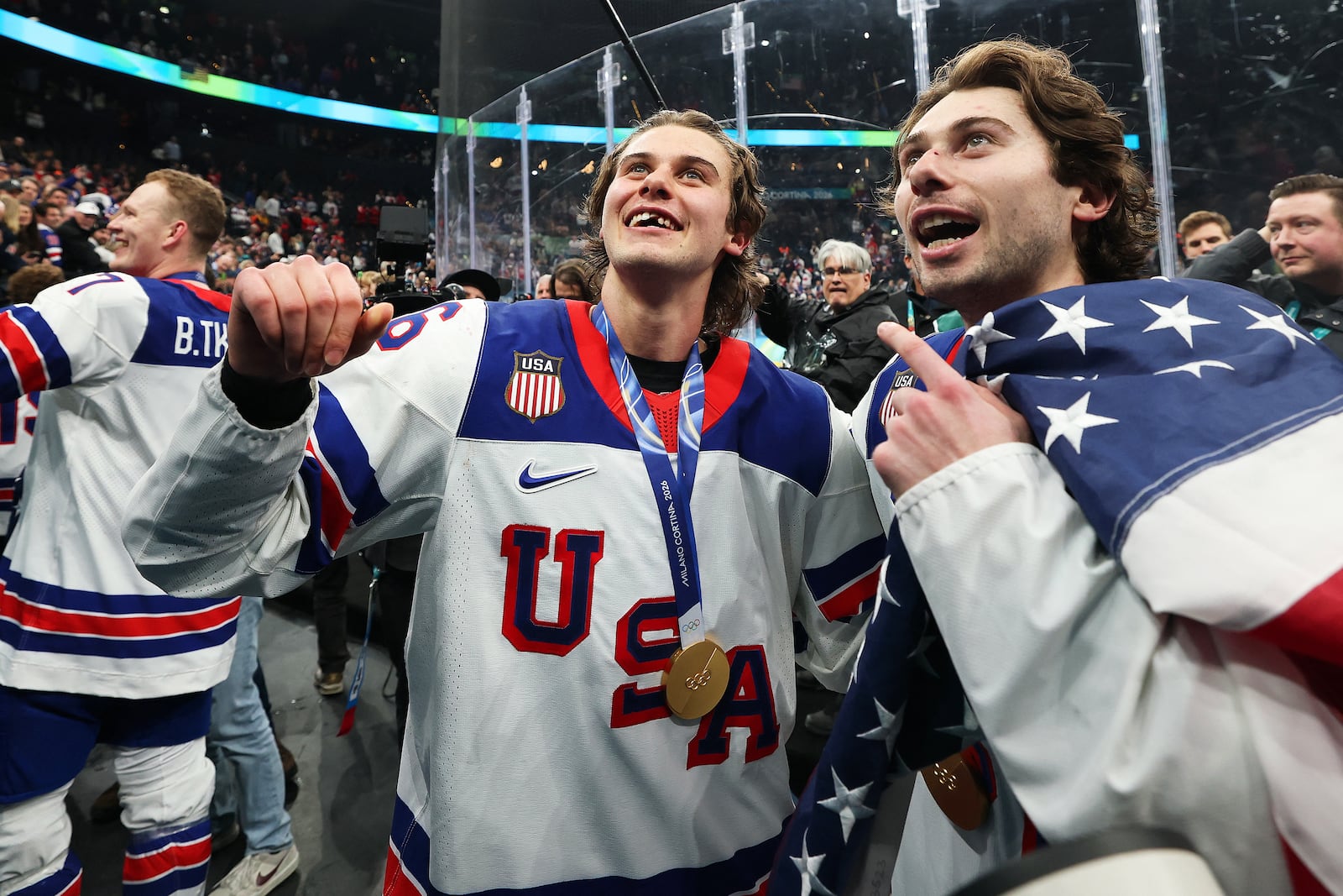 Jack Hughes celebrates with teammates during the victory ceremony.