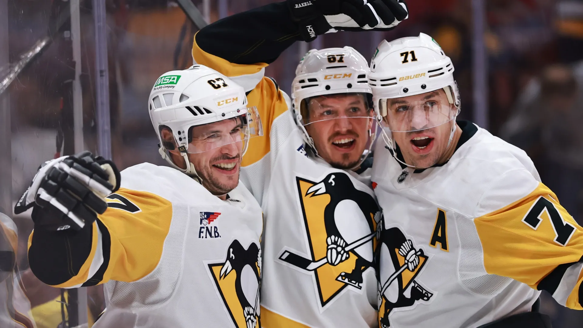 Sidney Crosby celebrates his goal with Evgeni Malkin and Rickard Rakell in 2025 (Source: Carmen Mandato/Getty Images)