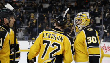 Alexis Gendron celebrating a Providence Bruins win with Michael DiPietro
