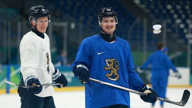 Sebastian Aho, right, of the Carolina Hurricanes and Team Finland, chats with Oliver Kapanen during training at the Milano Cortina 2026 Winter Olympics at Milano Santagiulia Ice Hockey Arena on Feb. 9, 2026 in Milan, Italy.