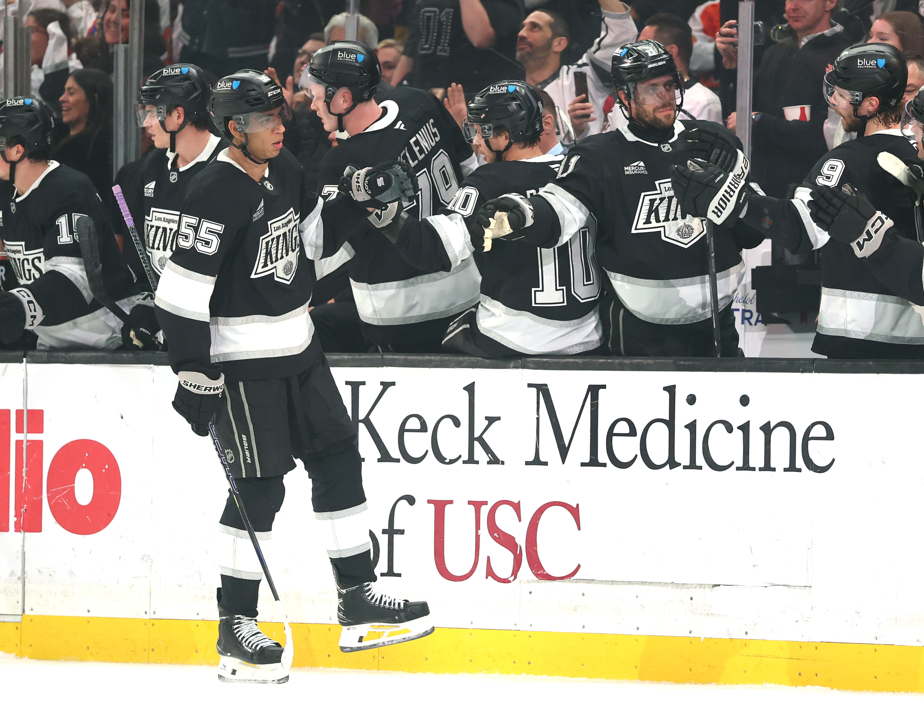 The Kings’ Quinton Byfield (55) celebrates his goal with his...