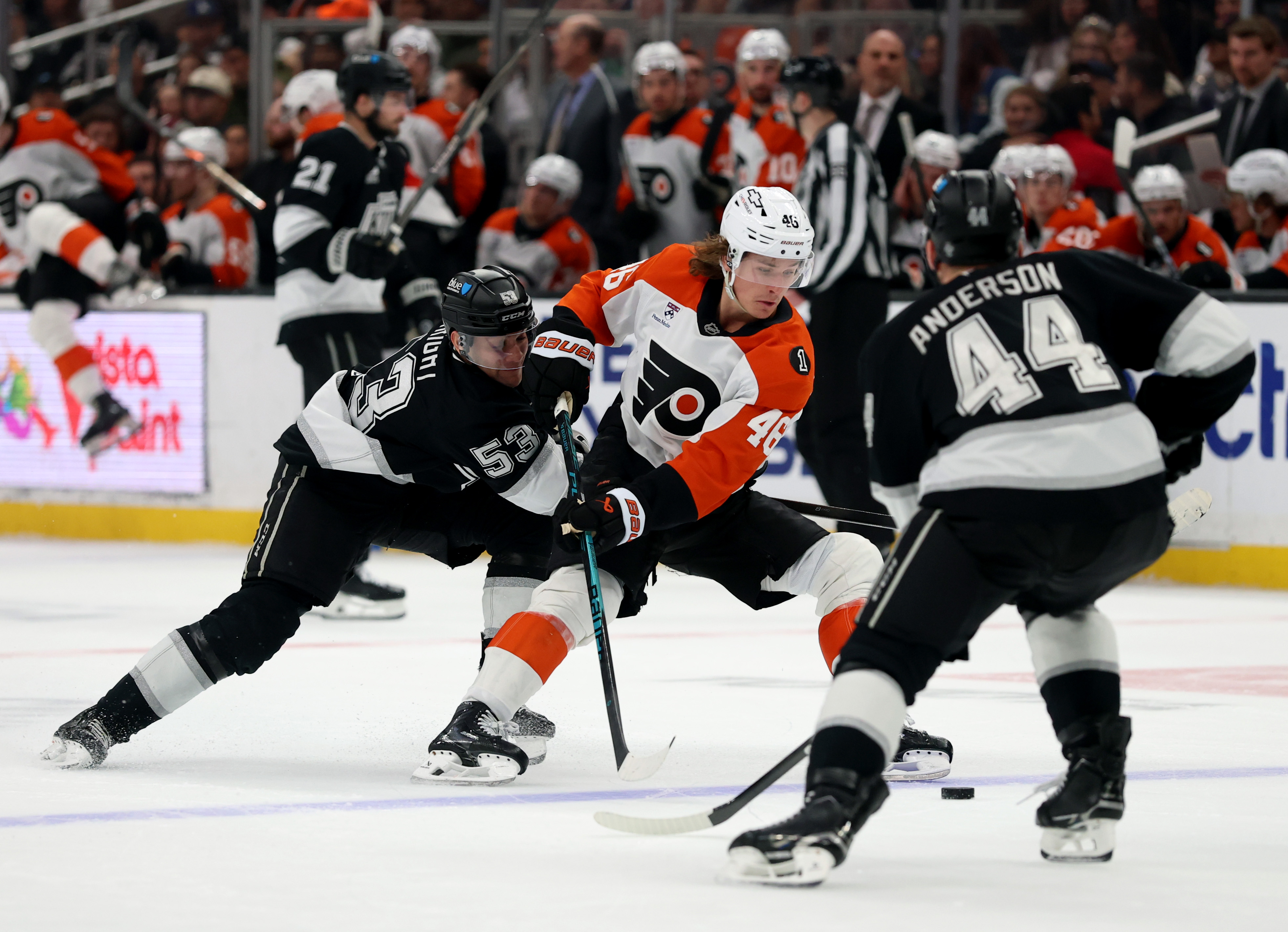 The Philadelphia Flyers’ Trevor Zegras (46) plays the puck between...