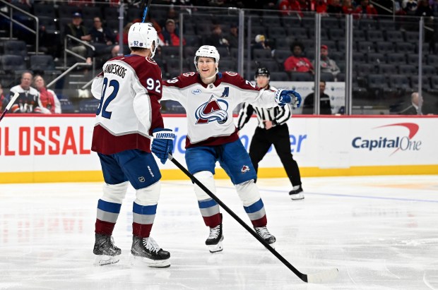 Gabriel Landeskog (92) of the Colorado Avalanche celebrates with Nathan MacKinnon (29) after scoring in the third period against the Washington Capitals at Capital One Arena on March 22, 2026 in Washington, DC. (Photo by Greg Fiume/Getty Images)