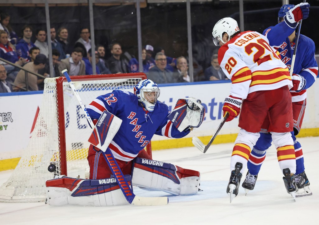 Jonathan Quick makes one of his 21 saves during the Rangers' win over the Flames at  the Garden.