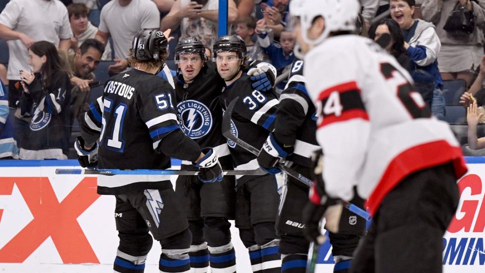 Tampa Bay Lightning celebrate a goal by left wing Brandon Hagel (38) during the second period of an NHL hockey game against the Ottawa Senators Saturday, March 28, 2026, in Tampa, Fla. (AP Photo/Jason Behnken)