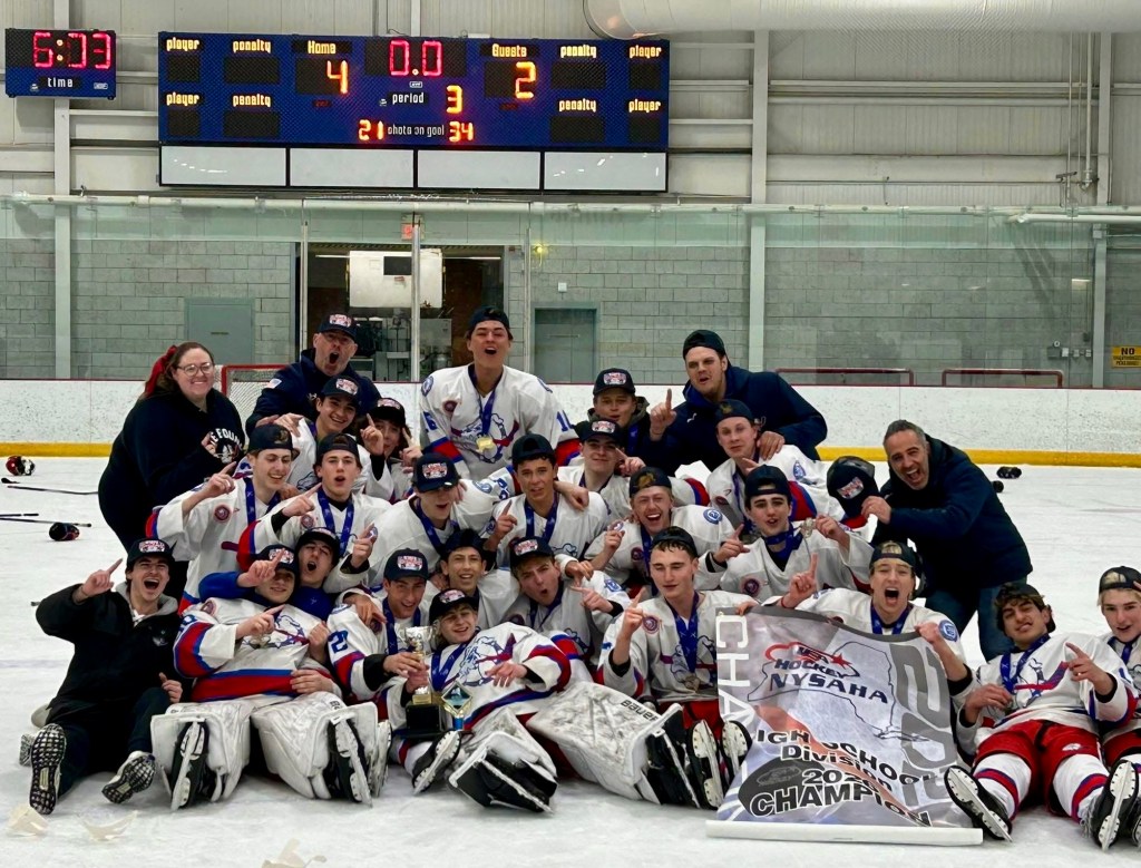 Bellmore-Merrick celebrates after winning the state championship in high school boys hockey.