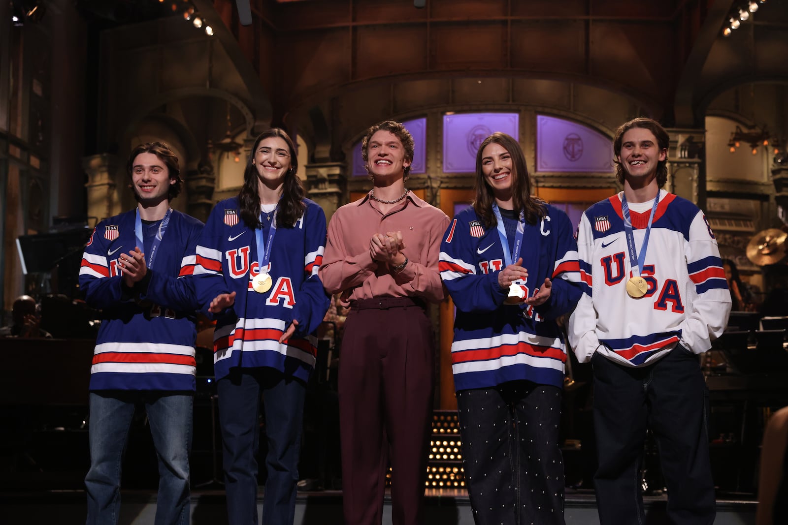 Quinn Hughes, Megan Keller, host Connor Storrie, Hilary Knight, and Jack Hughes during "Saturday Night Live."