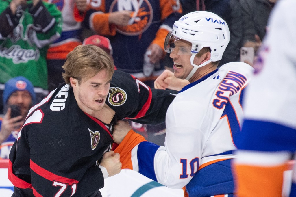 Brayden Schenn and Ridly Greig in a heated exchange during a hockey game.