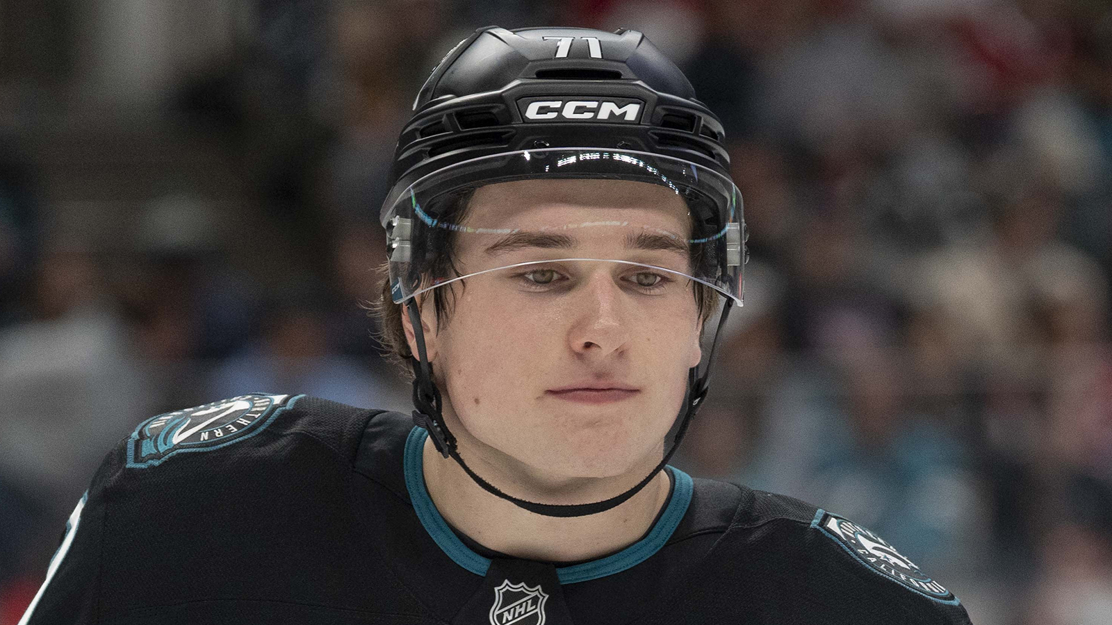 Macklin Celebrini staring on the ice