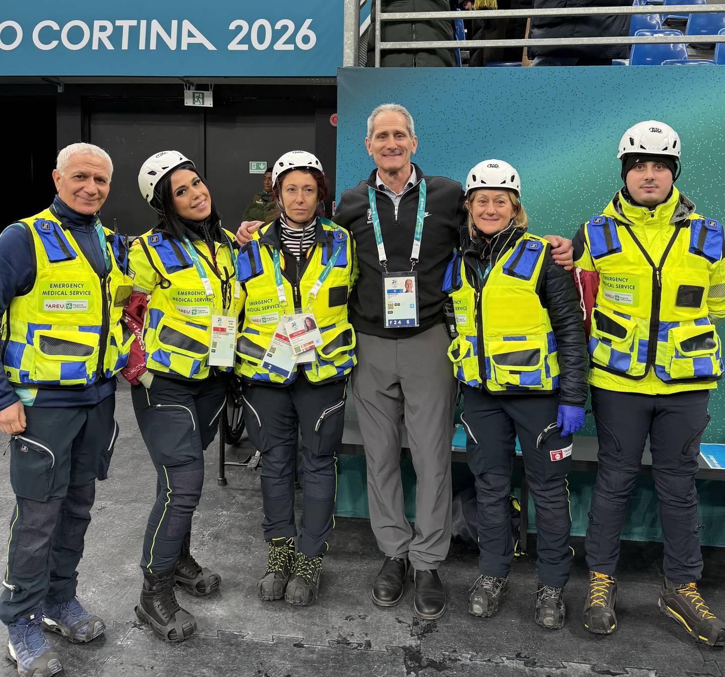 La Salle native and St. Bede graduate Dr. Michael Stuart (center) International Ice Hockey Federation [IIHF] medical supervisor for men’s ice hockey at the 2026 Winter Olympic Games, is seen here meeting with the emergency medical services team in Milano.