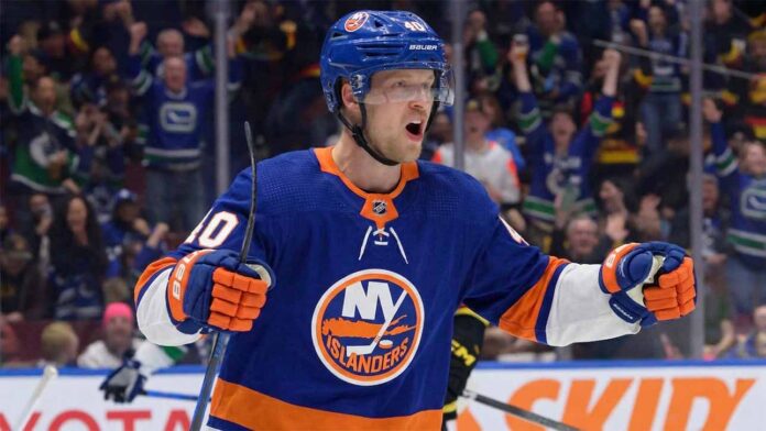 Vancouver Canucks center Elias Pettersson, wearing the 'Flying Skate' retro jersey, celebrating a goal, amidst New York Islanders trade speculation.