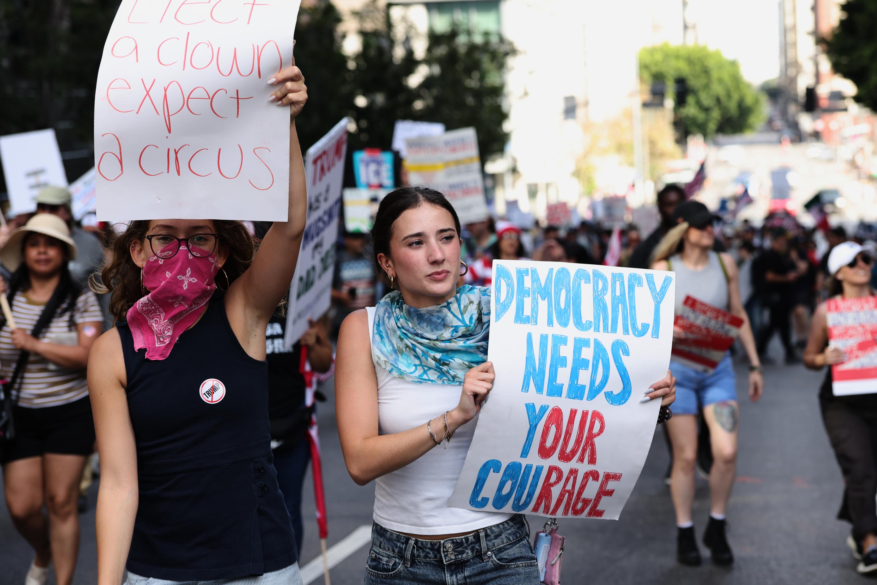Demonstrators march through downtown Los Angeles during a