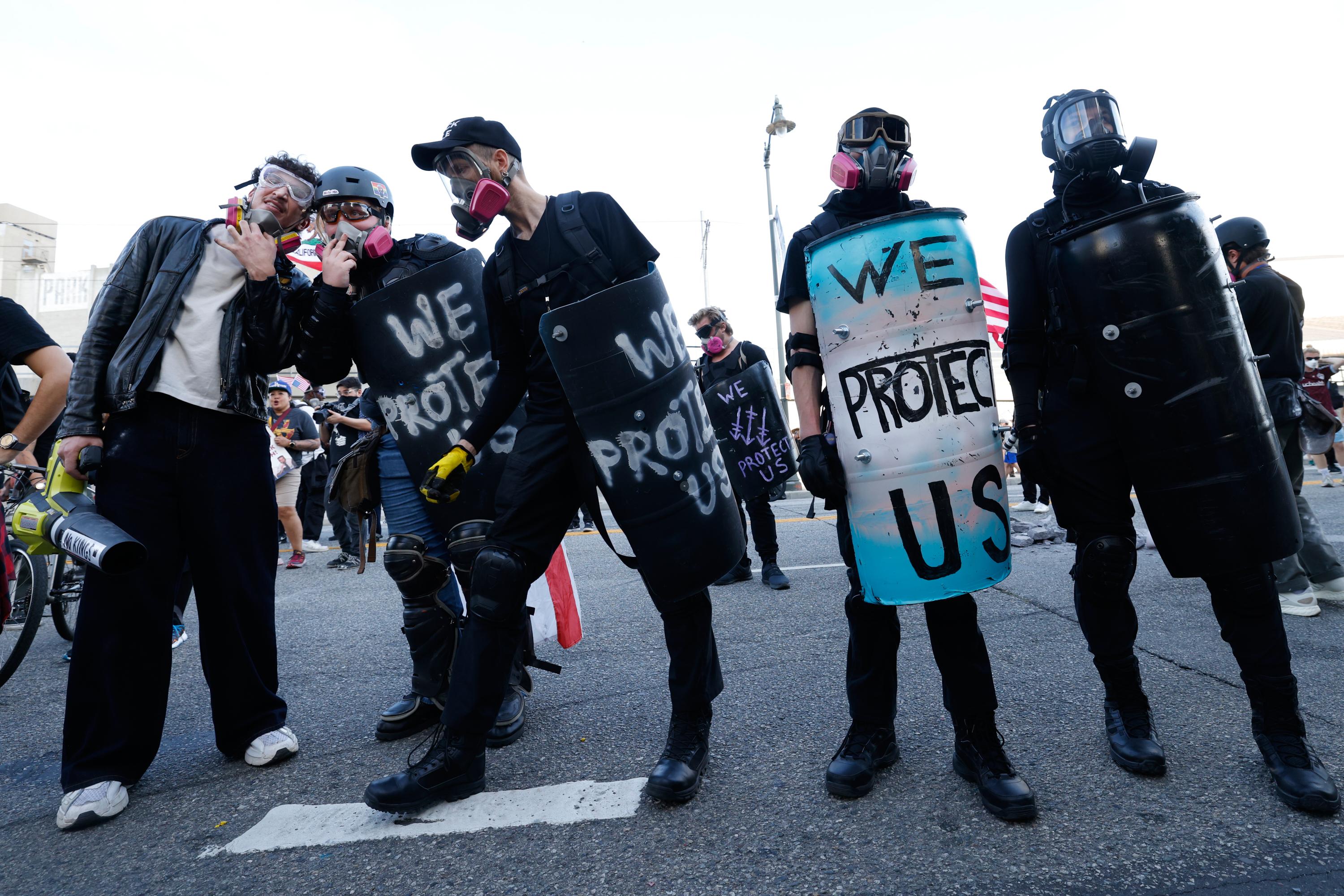 Protesters stand off against police outside the Metropolitan Detention Center in downtown Los Angeles.