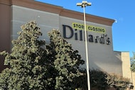 A sign on the exterior of the Dillard's department store at The Shops at Willow Bend reads...
