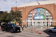 A banner prominently featuring stars from the Dallas Mavericks and Dallas Stars outside the...
