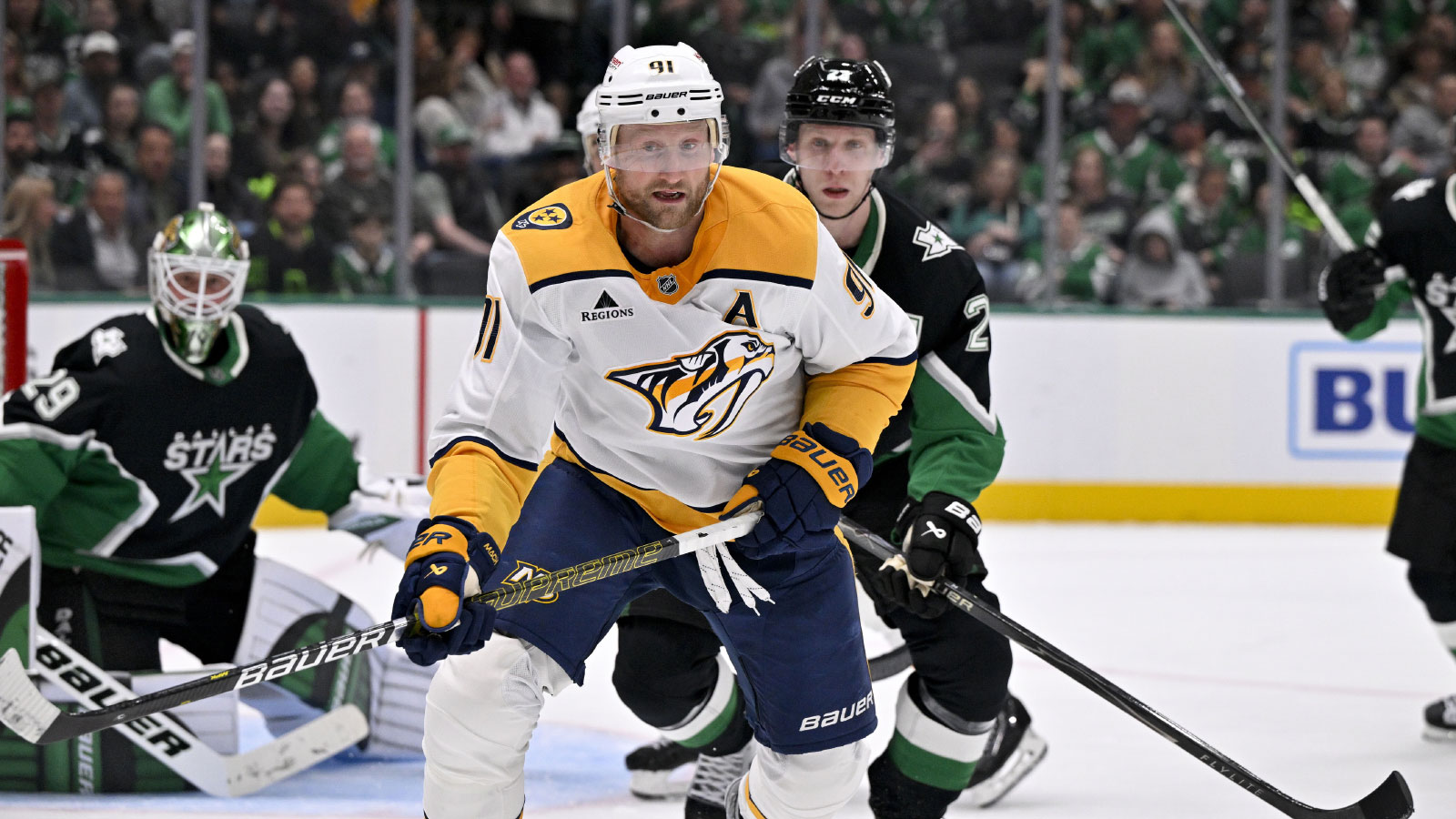 Nashville Predators center Steven Stamkos (91) and Dallas Stars defenseman Esa Lindell (23) chase the puck during the third period at the American Airlines Center.