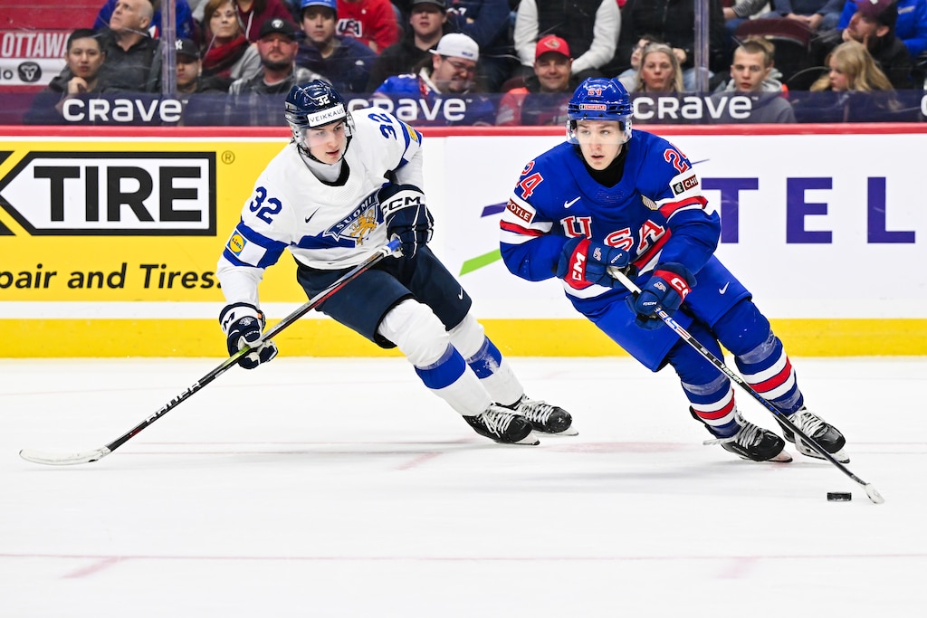 Cole Hutson #24 of Team USA skates the puck against Emil Hemming #32 of Team Finland in the third period of the gold medal game during the 2025 IIHF World Junior Championship at Canadian Tire Centre on January 5, 2025 in Ottawa, Ontario, Canada.