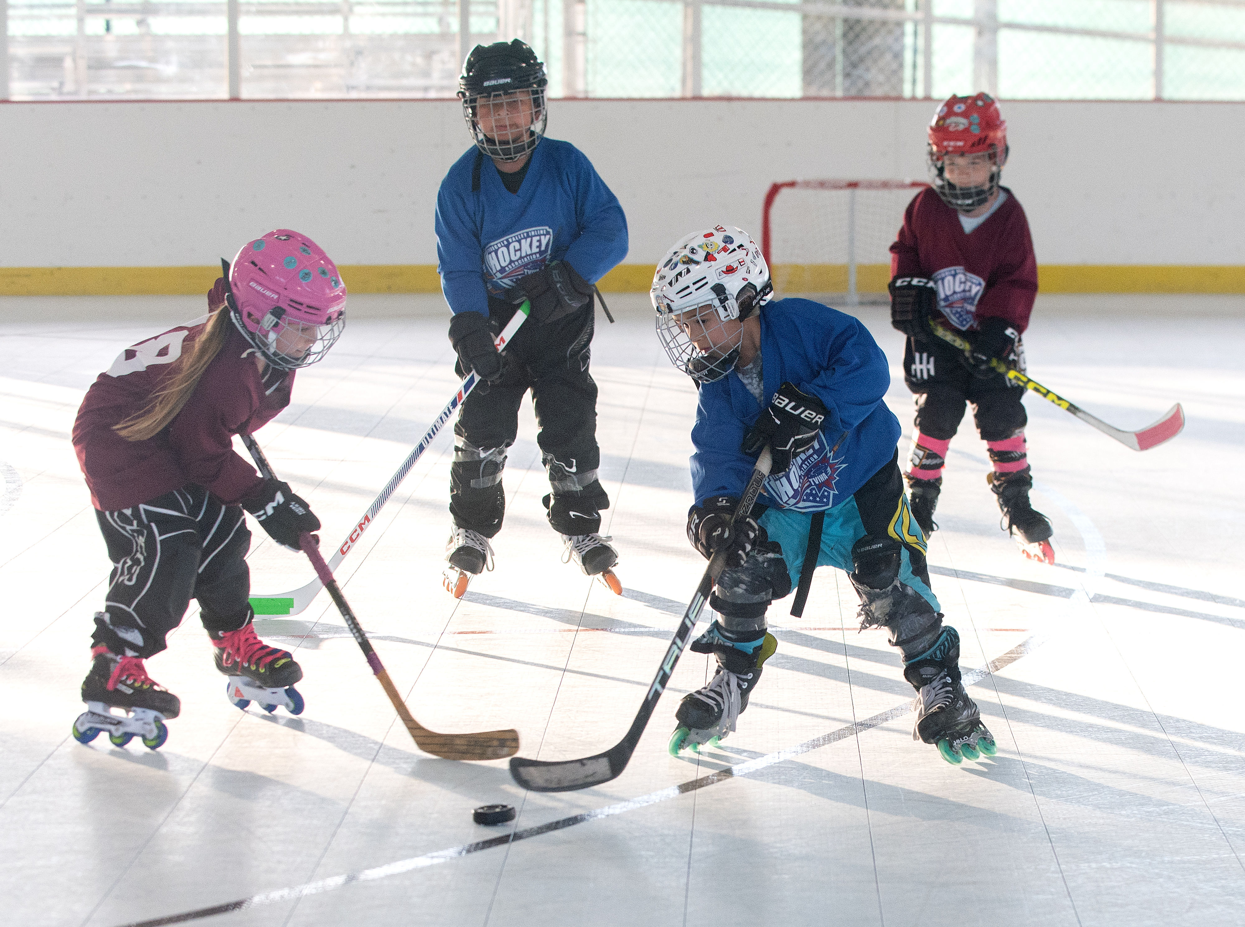 Players from the under-6 Crimson and Blue teams battle for...
