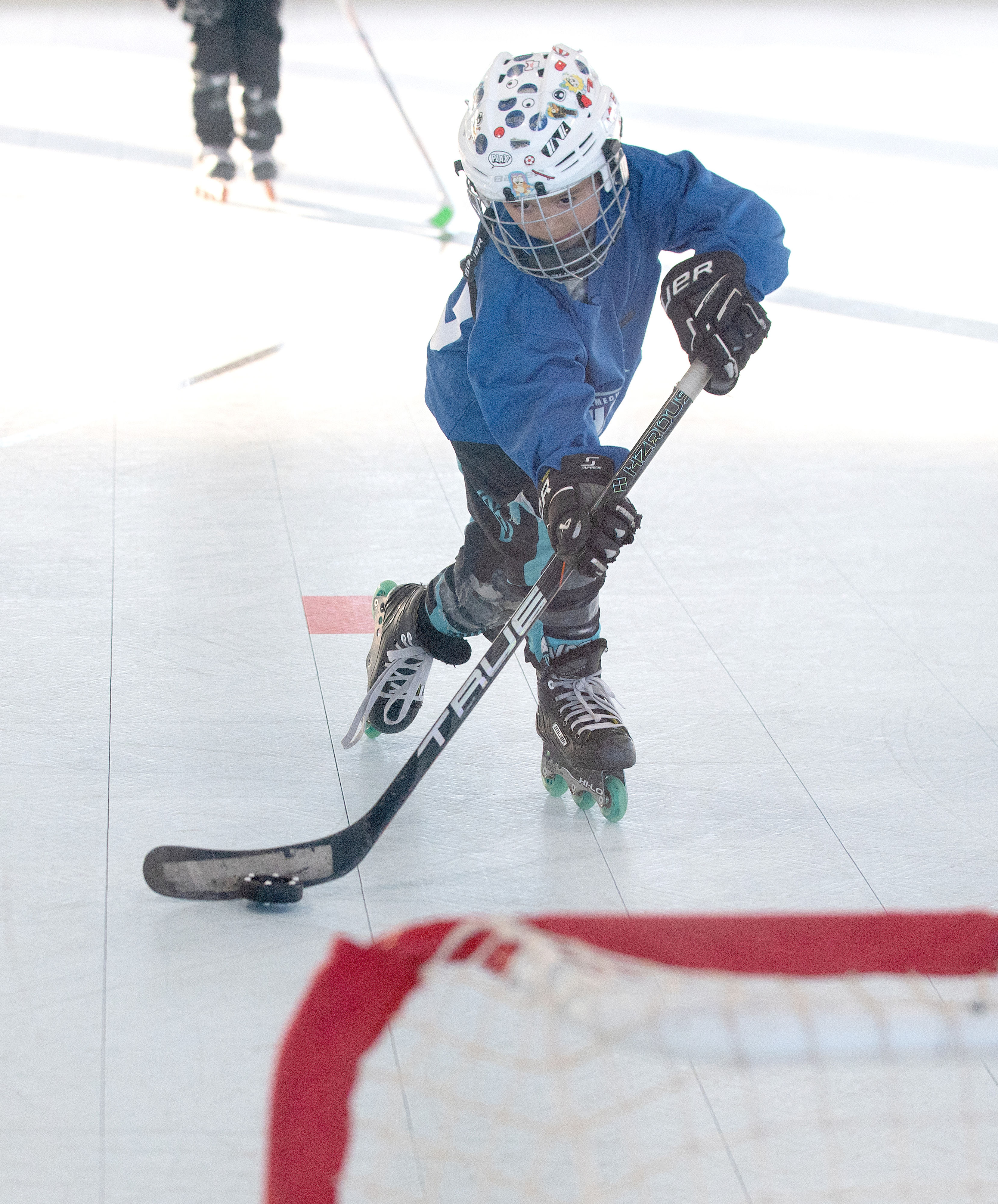 A player from the under-6Â  Blue Team scores a goal...