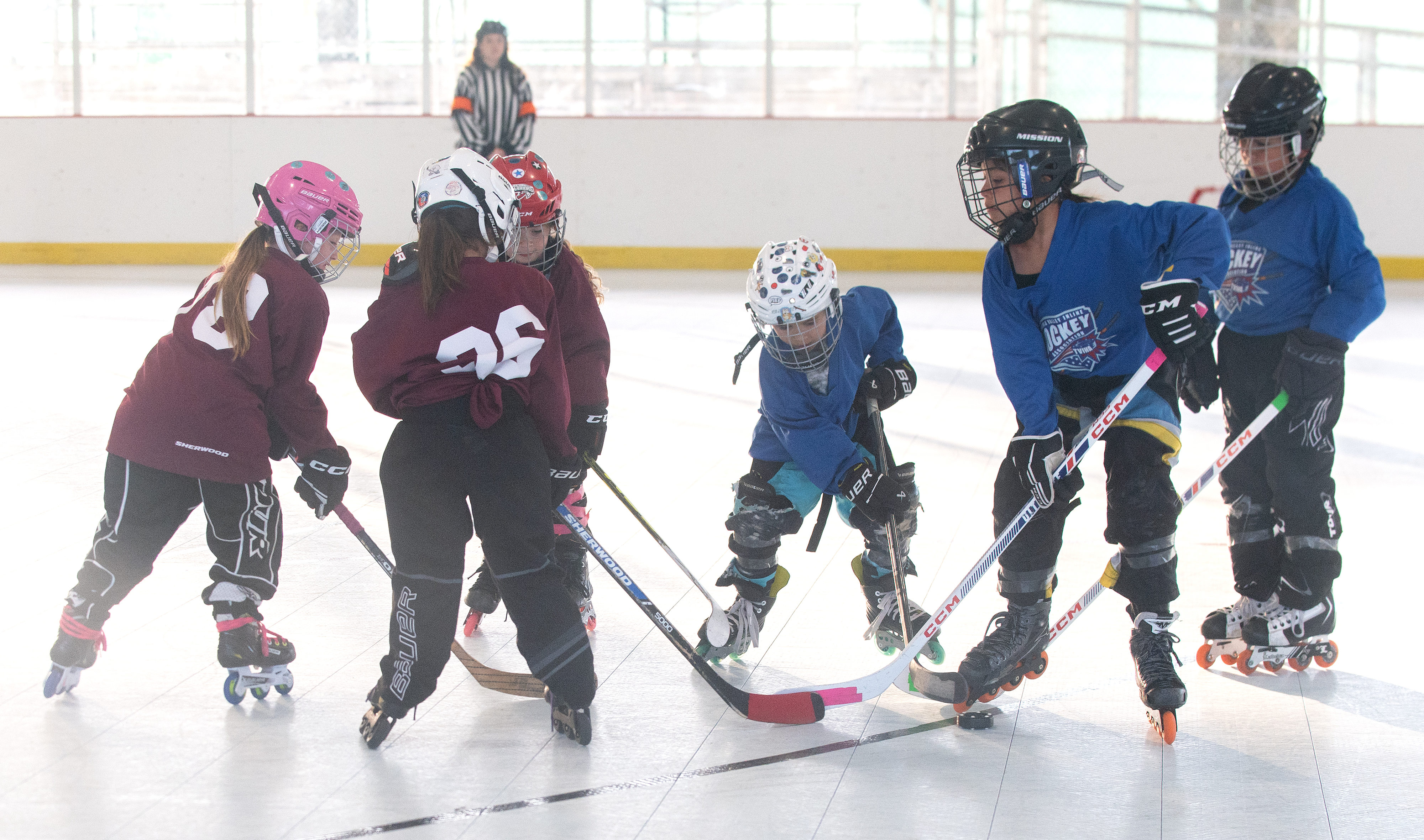 Players from the under-6 Crimson and Blue teams compete during...