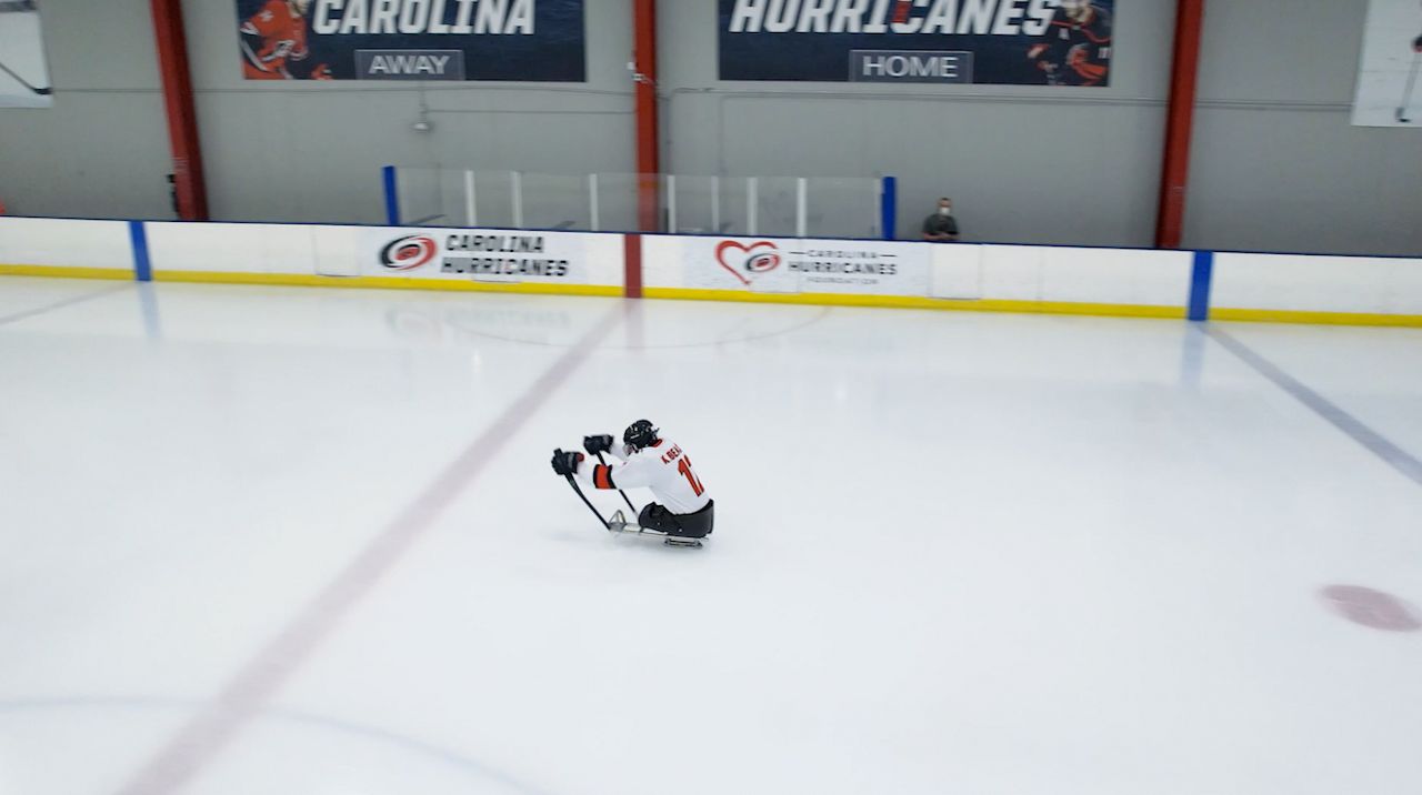 Kayden flying down the ice at a Hurricanes Sled Hockey practice in 2025. (Spectrum News 1)