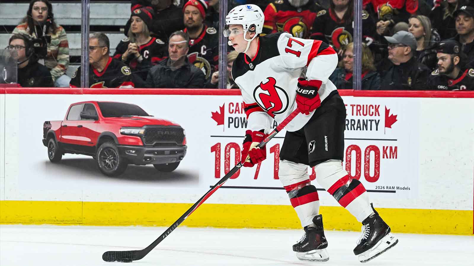  New Jersey Devils defenseman Simon Nemec (17) plays the puck against the Ottawa Senators during the third period at Canadian Tire Centre. 