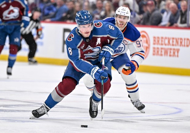 Cale Makar (8) of the Colorado Avalanche controls the puck as Connor McDavid (97) of the Edmonton Oilers chases during the third period of the Oilers' 4-3 win at Ball Arena on Tuesday, March 10, 2026. (Photo by AAron Ontiveroz/The Denver Post)