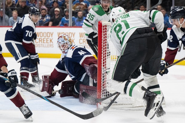 Goaltender Scott Wedgewood (41) of the Colorado Avalanche saves a shot by left wing Jason Robertson (21) of the Dallas Stars during overtime on Wednesday, March 18, 2026, at Ball Arena in Denver. (Photo by Timothy Hurst/The Denver Post)