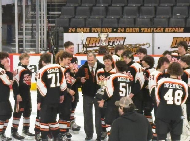 Northampton ice hockey coach Brian Ruff, center, celebrates winning the Lehigh Valley Scholastic Hockey League title with his team. Ruff is also the league president and coaches all of the teams in the Northampton club. (Keith Groller/The Morning Call)