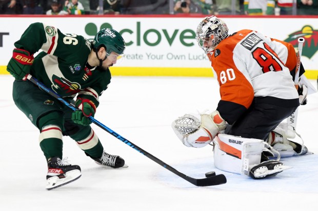 Minnesota Wild right wing Mats Zuccarello (36) attempts to score while Philadelphia Flyers goaltender Dan Vladar (80) prepares to save the puck during a shootout in an NHL hockey game Thursday, March 12, 2026, in St. Paul, Minn. (AP Photo/Ellen Schmidt)