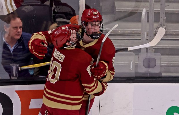 Boston College Eagles forward Dean Letourneau (29) is congratulated on his goal by Boston College Eagles forward James Hagens (10) as UConn takes on BC in the Hockey East semi finals at the Garden.  (Staff photo by Stuart Cahill)