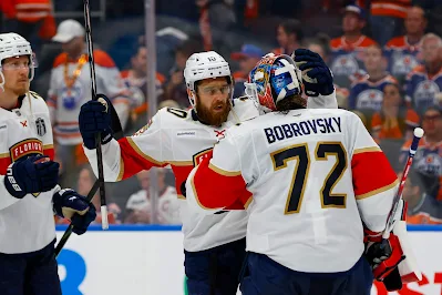 Florida Panthers Sergei Bobrovsky and AJ Greer celebrate after 2025 game.
